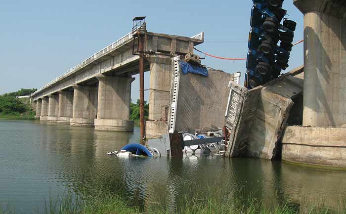 A bridge collapse over water.