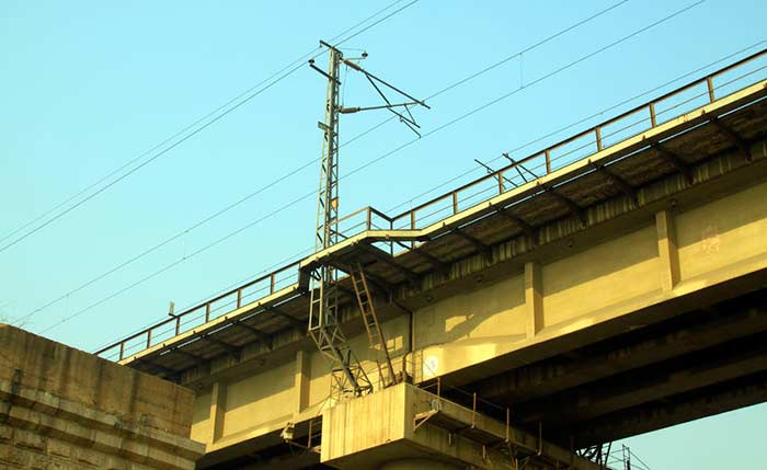 Power lines spanning a bridge.