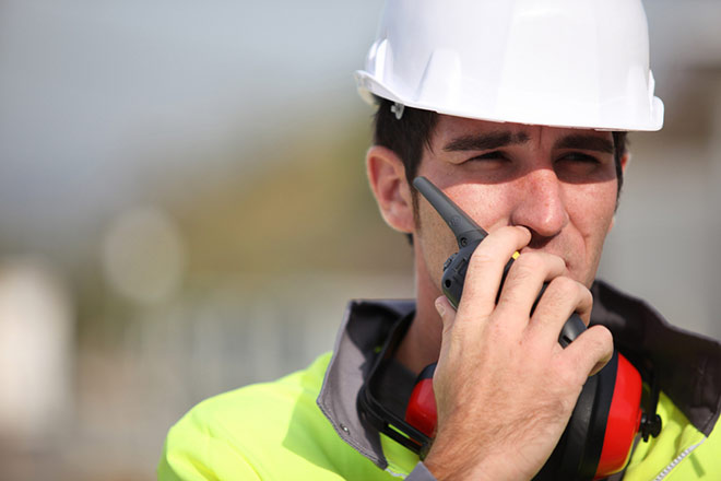 A bridge worker wearing reflective clothing.