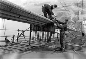 Construction workers building the Golden Gate Bridge.