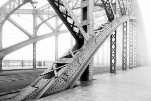 A steel bridge in black and white