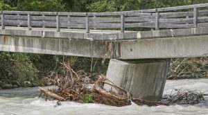 flooded bridge with structural damage
